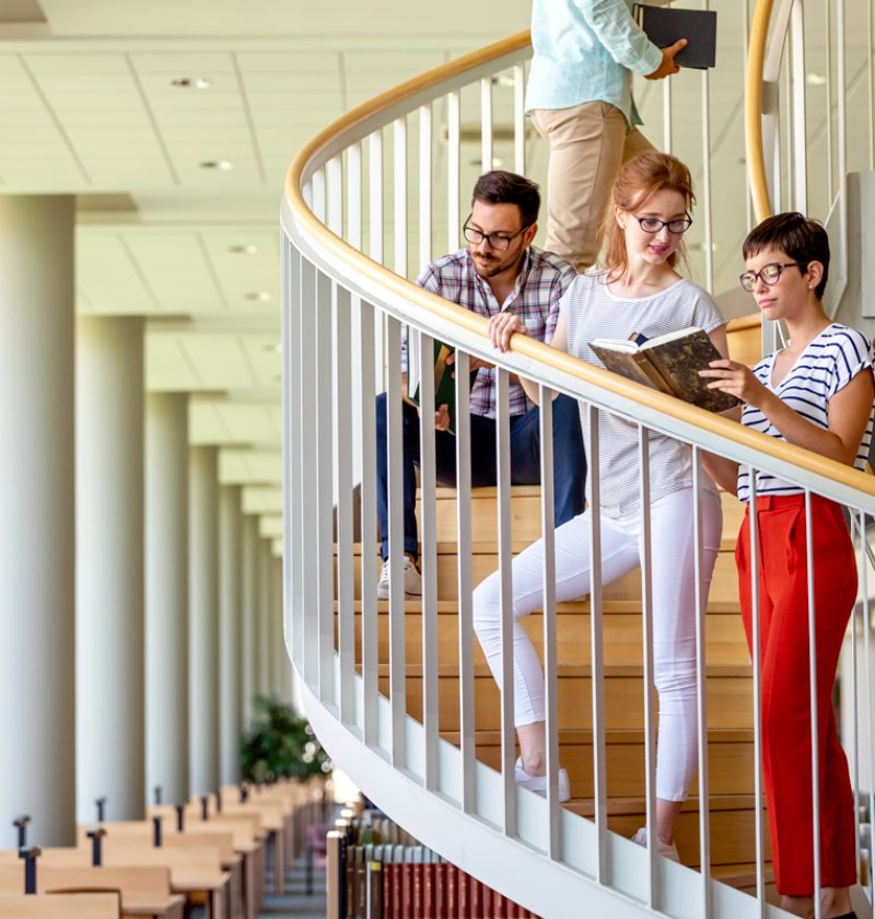 happy-group-of-students-studying-and-working-toget